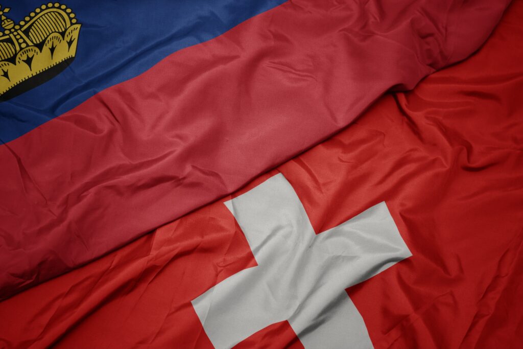 Flags of Switzerland and USA – safe third countries