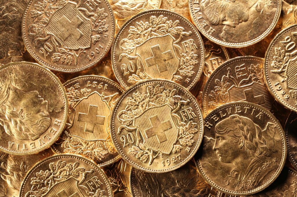 Several 20 Franc Vreneli gold coins side by side with one another